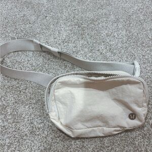 Popular Lululemon Belt Bag in White, Used but Good Condition!